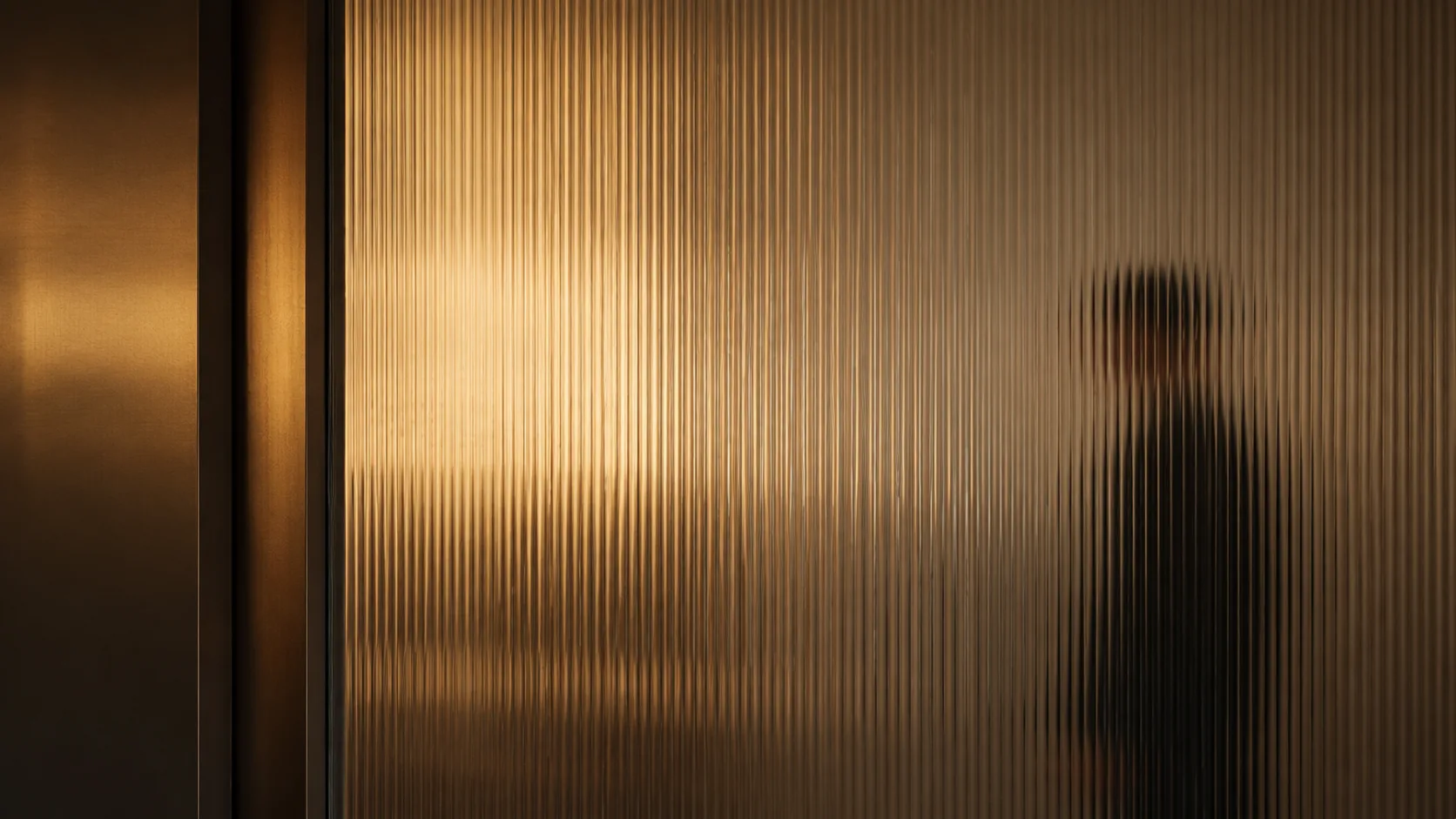 Warm fluted glass partition in a private office